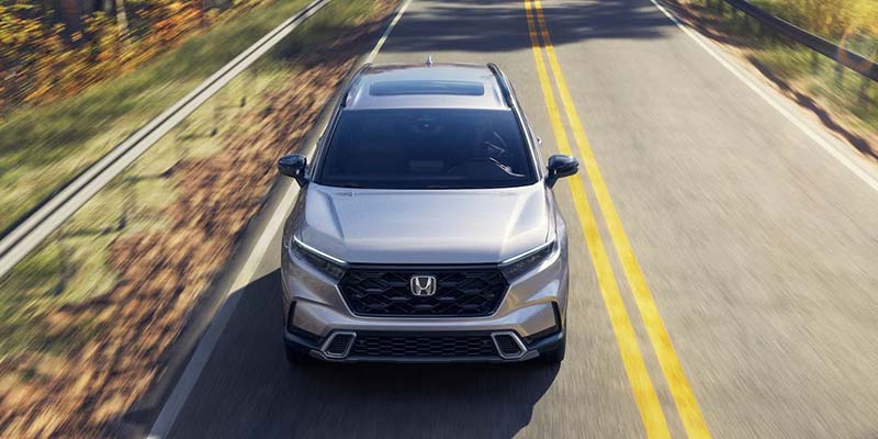 Silver 2026 Honda CR-V Hybrid driving down a highway in Tupelo, MS